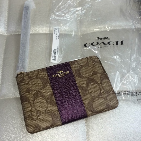 Coach Handbags - NEW Coach wristlet wallet logo raspberry purple